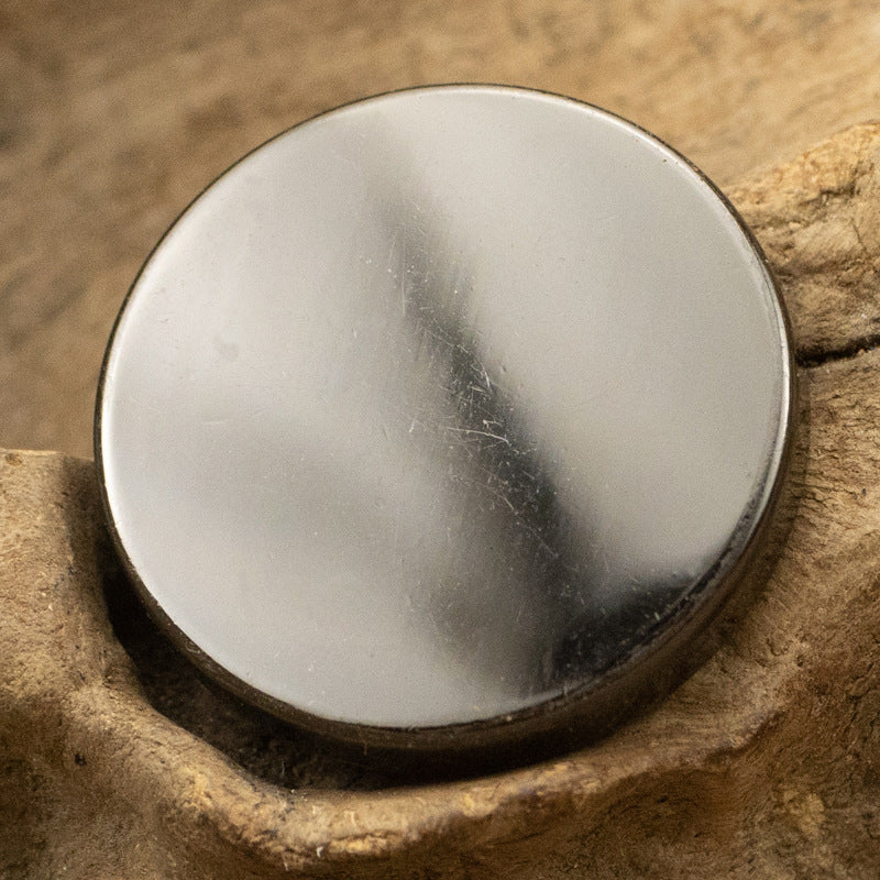 Round flat metal button with shank, polished silver-white