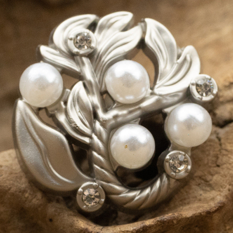 Silver leaf metal button with white pearl centers and diamond-inlaid accents