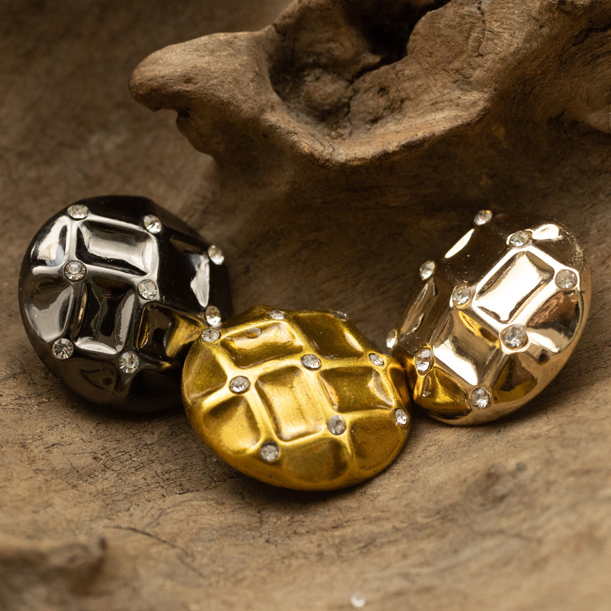 Diamond woven metal buttons in gold and black, with crystal-like rhinestones