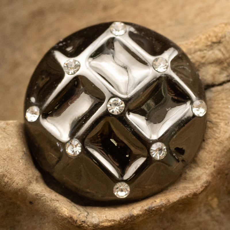 Black diamond woven metal button with reflective finish and rhinestone accents