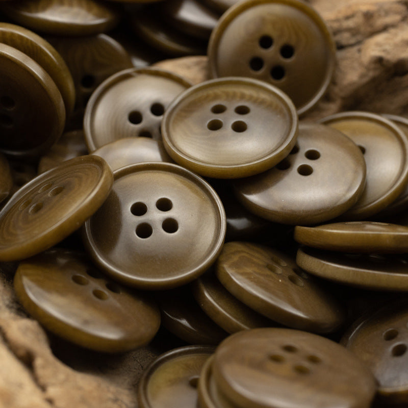 Assorted round 4-hole vintage buttons in tan and olive-brown natural finish