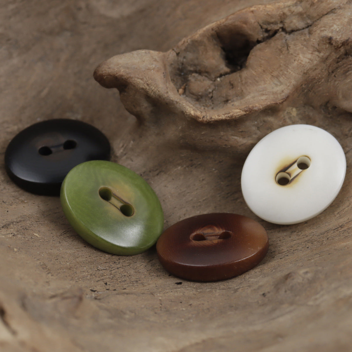 Charred two-hole oval corozo buttons in white, green, black, and wine, 10pcs