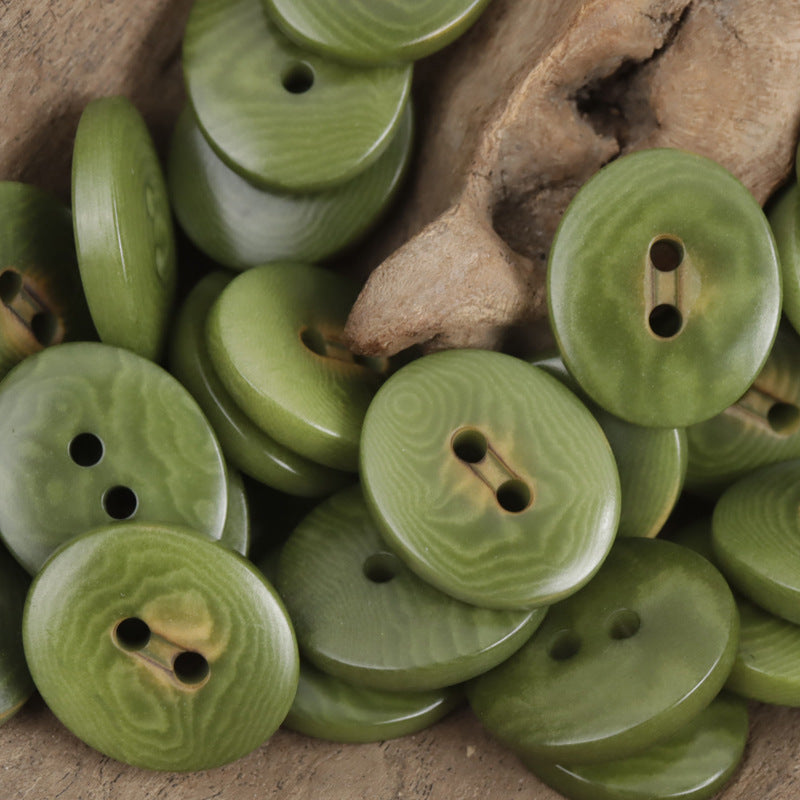 Green oval corozo buttons with two holes, charred finish, 10pcs