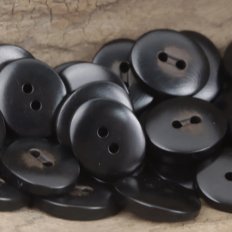 Black oval corozo buttons with two holes, charred finish, 10pcs