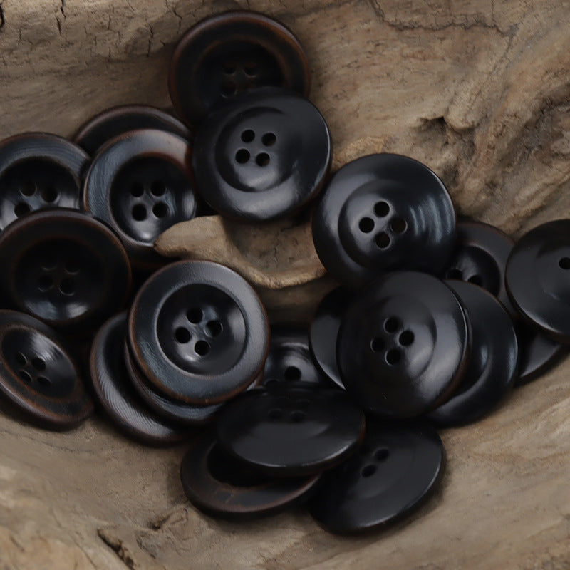 Palm nut corozo buttons, 4-hole, dark black/charcoal tones, wide-edged round style
