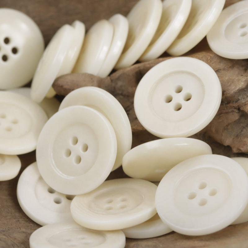 Cream/white 4-hole tagua nut buttons for shirts, close-up