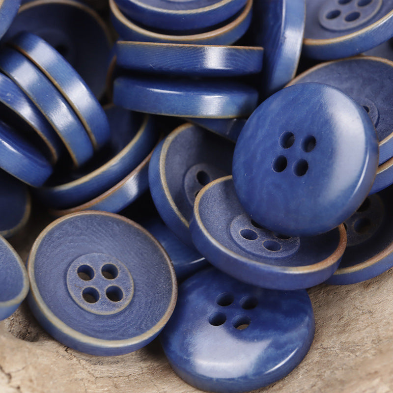 Bowl-shaped buttons in blue shades, round face with 2+2 holes set