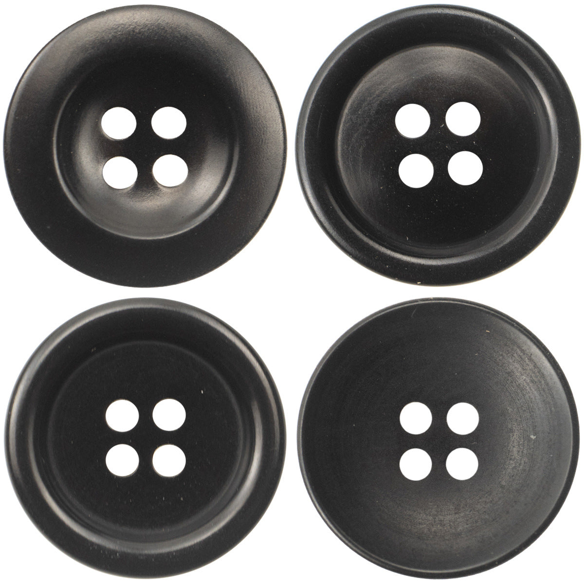 Black round 4-hole buttons, multiple pieces shown, front view