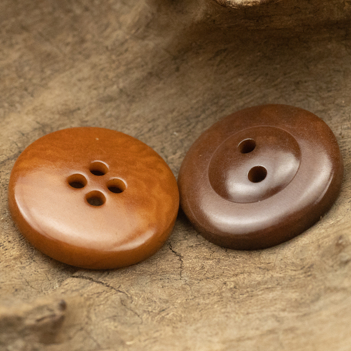 Reddish-brown vintage buttons: 4-hole front and 2-hole back view