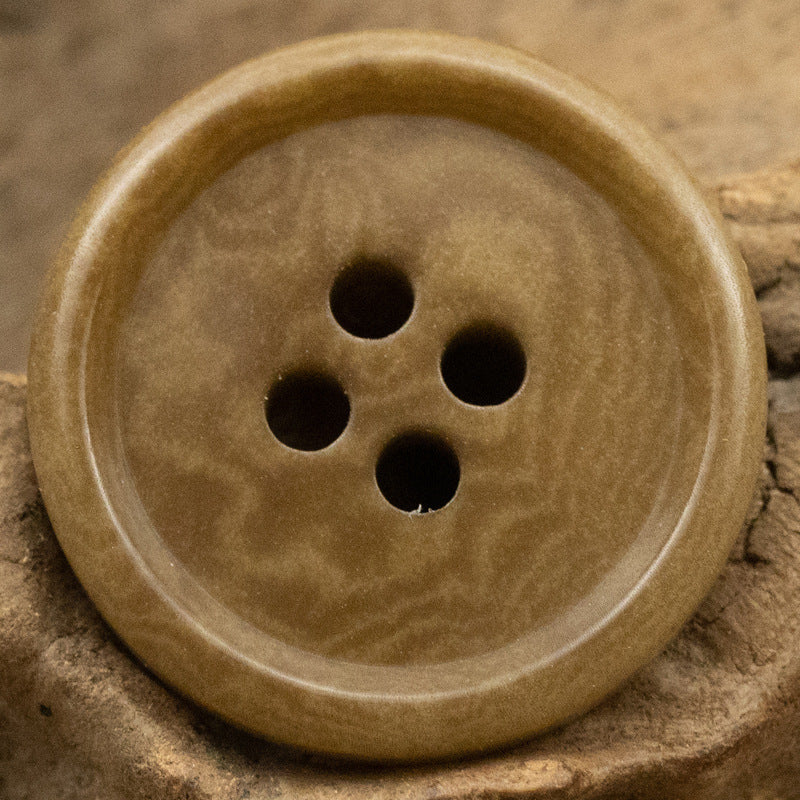 Deep khaki 4-hole fruit button, round face with four shank holes