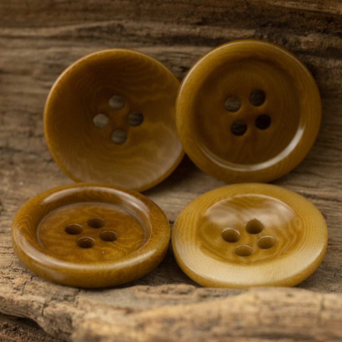 Khaki yellow 4-hole cardigan buttons, natural woodgrain texture, assorted tones