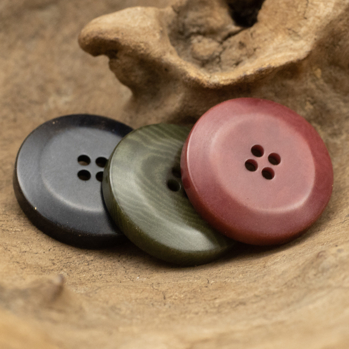 Rose red, army green, and dark trouser buttons with 4-hole design, natural finish