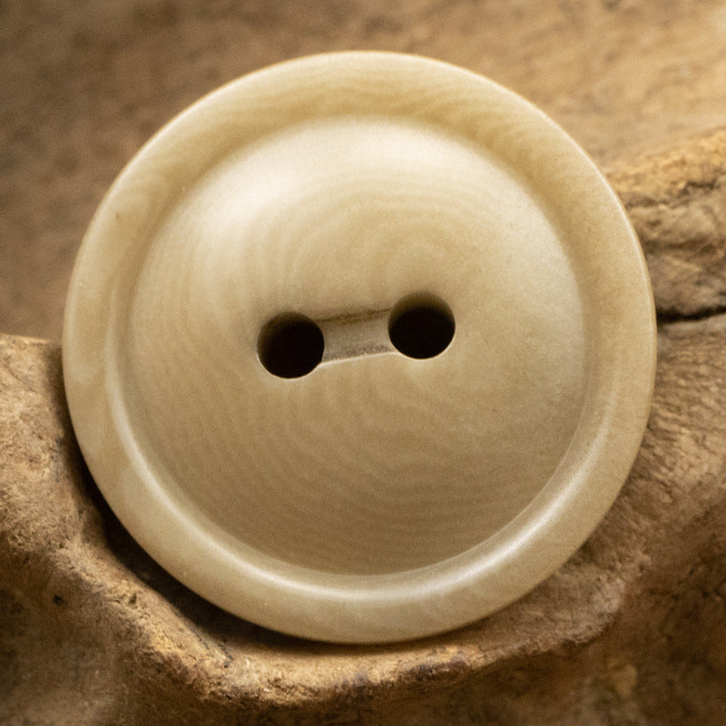 Round two-hole corozo button, natural beige with subtle grain texture