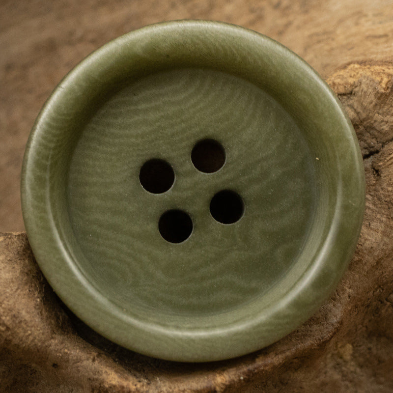 Thick-edged natural nut button, olive green color, 4 holes