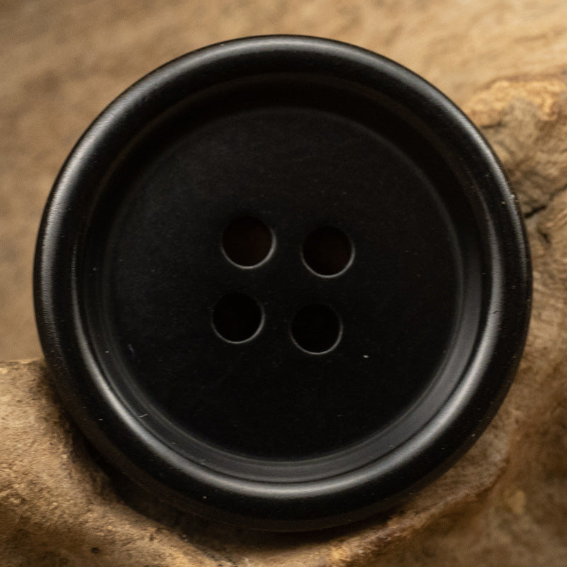 Thick-edged natural nut button, black color, 4 holes