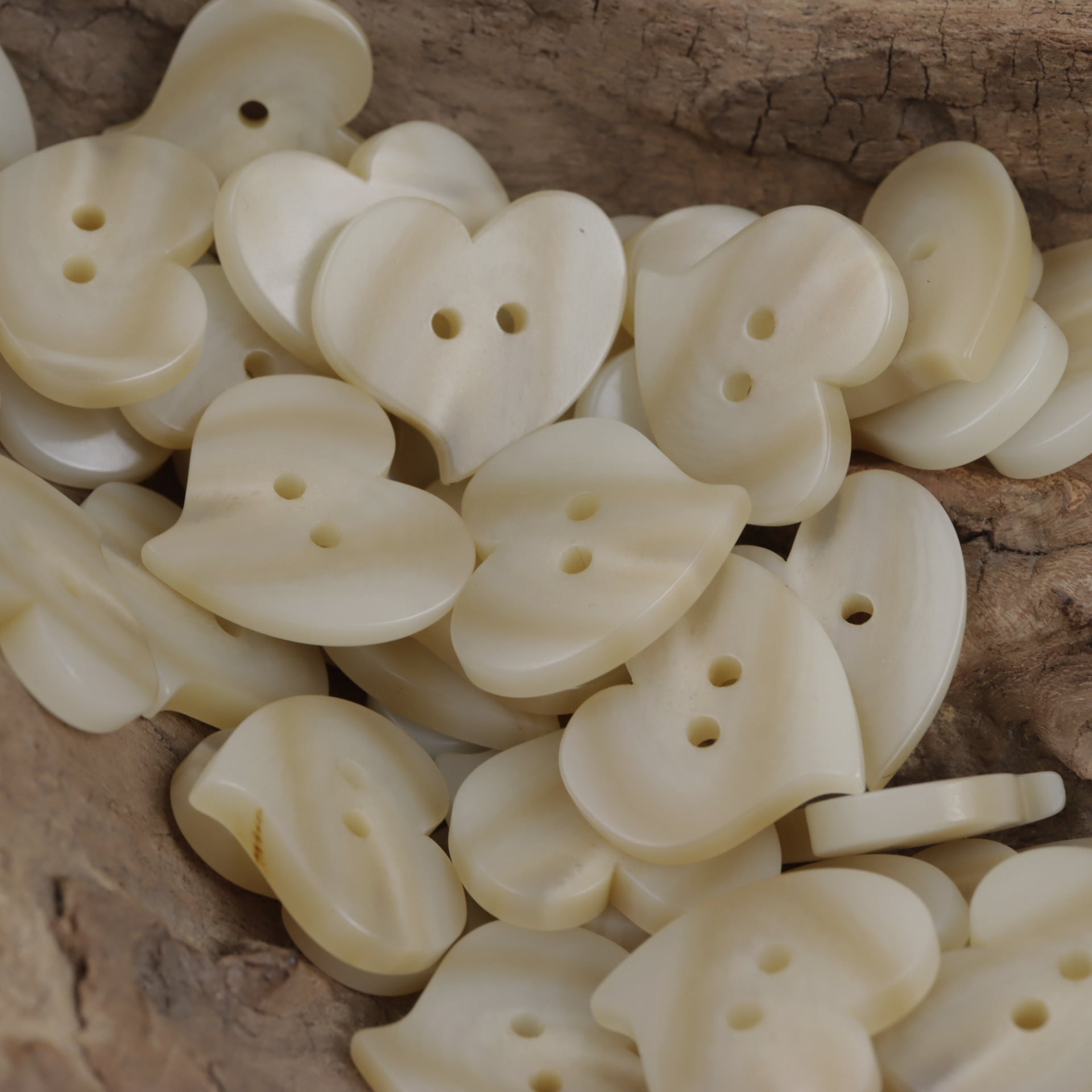 Heart-shaped resin flat buttons, two-hole, light beige