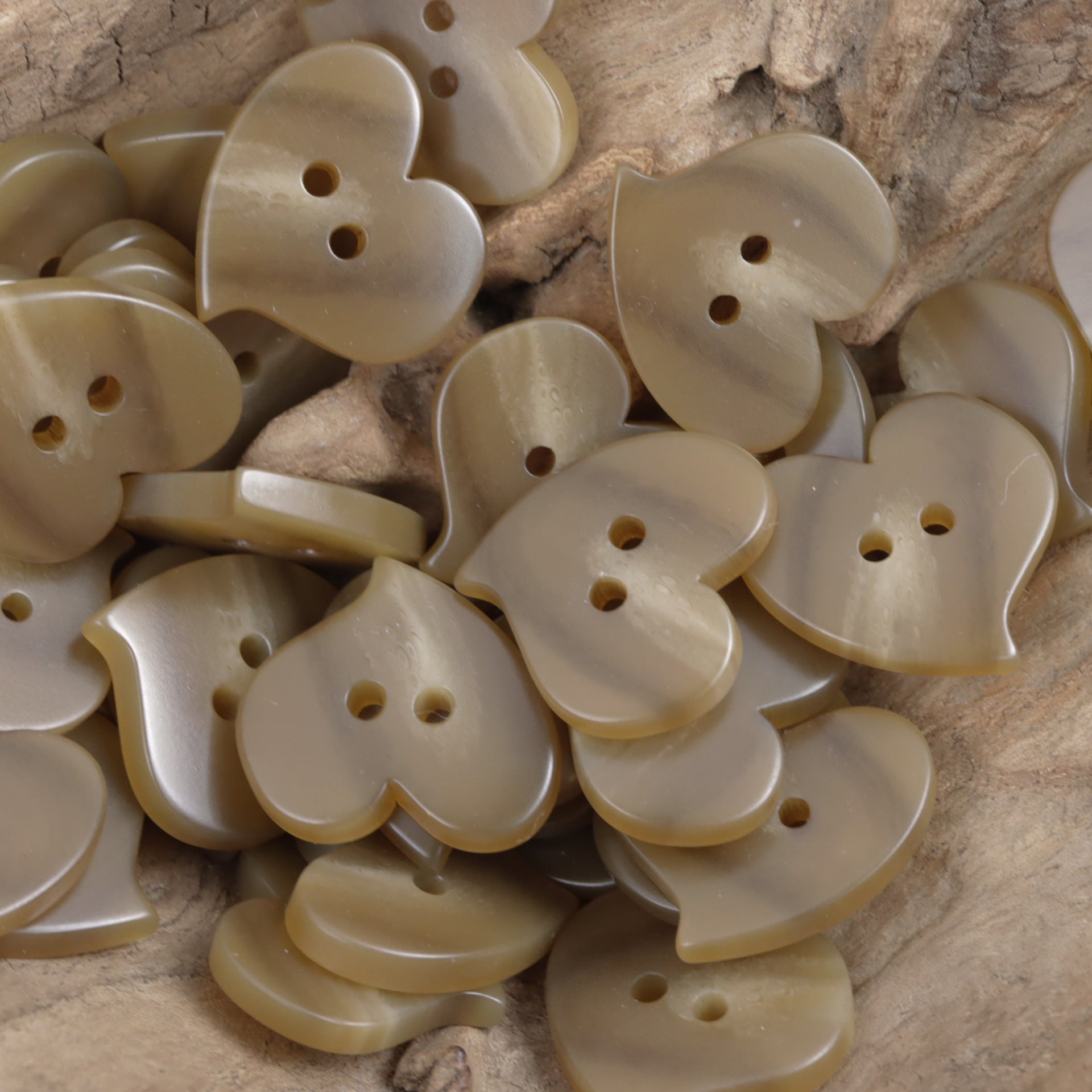 Heart-shaped resin flat buttons, two-hole, deep khaki tone