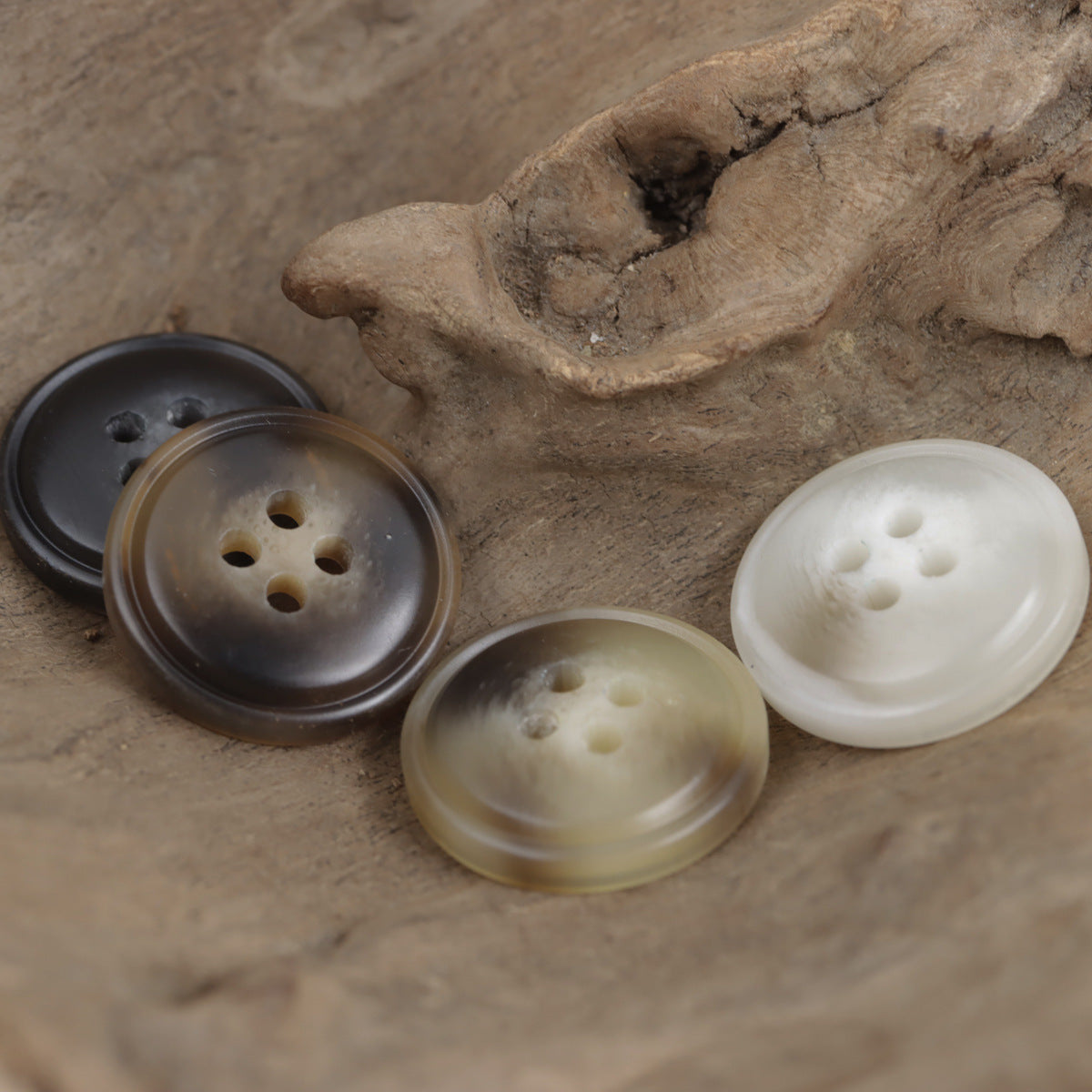 Four-hole resin buttons, glossy finish, assorted dark and light buttons