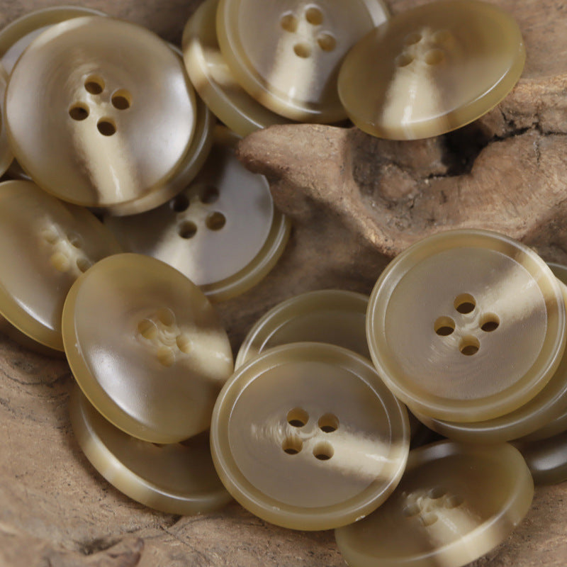 Light tan resin flat buttons, four-hole round design, marbled look