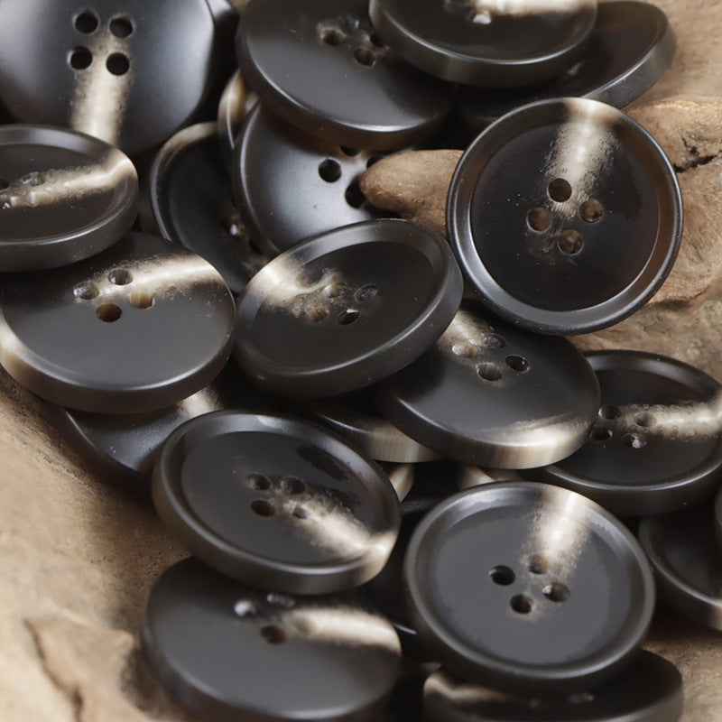 Dark resin flat buttons with four holes, round faces