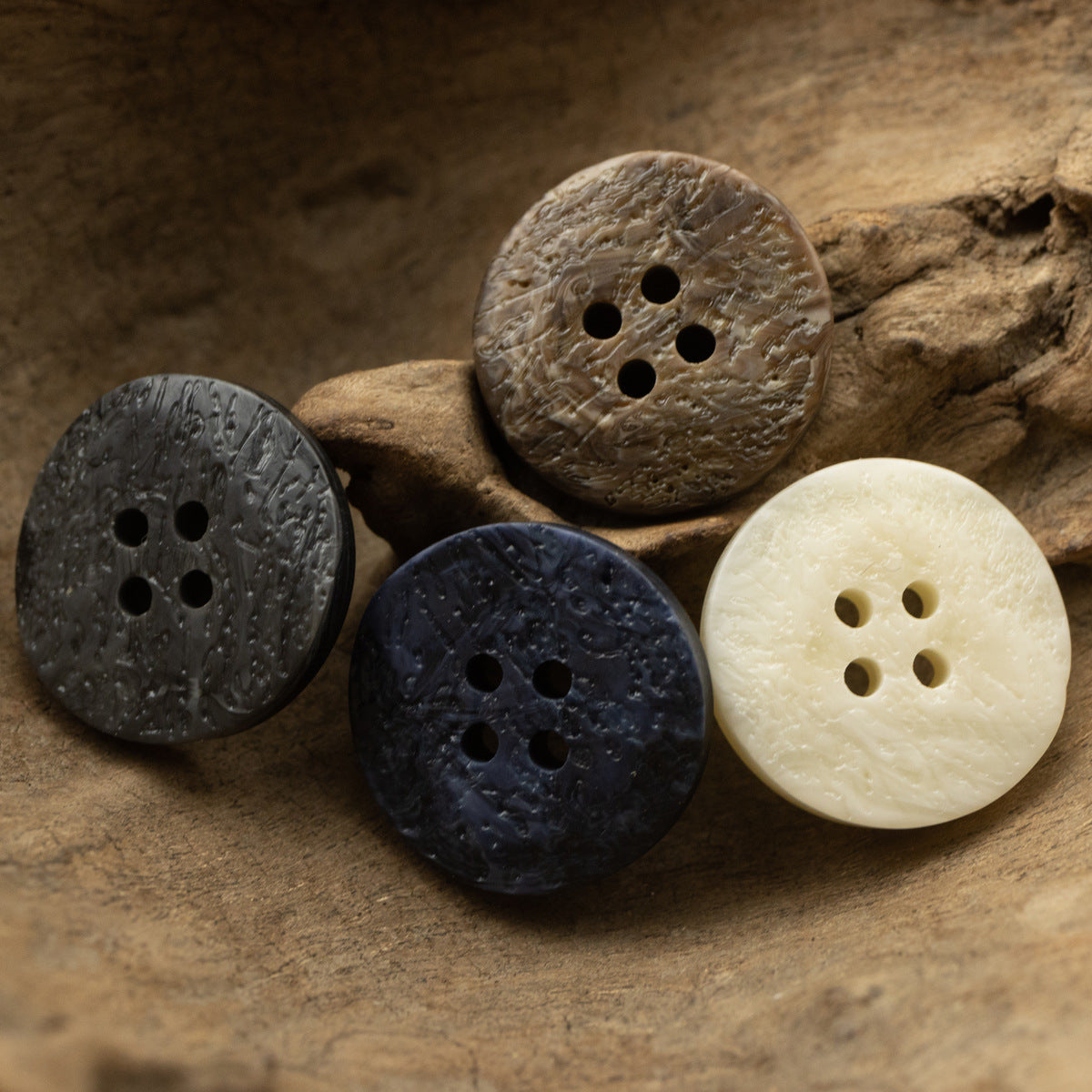 Resin coat buttons with irregular texture, round 4-hole set in beige, dark and blue tones