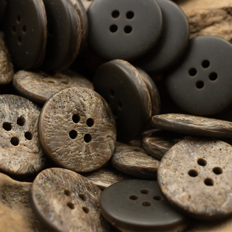 Mixed resin coat buttons with irregular texture, round 4-hole designs in tan, brown, black