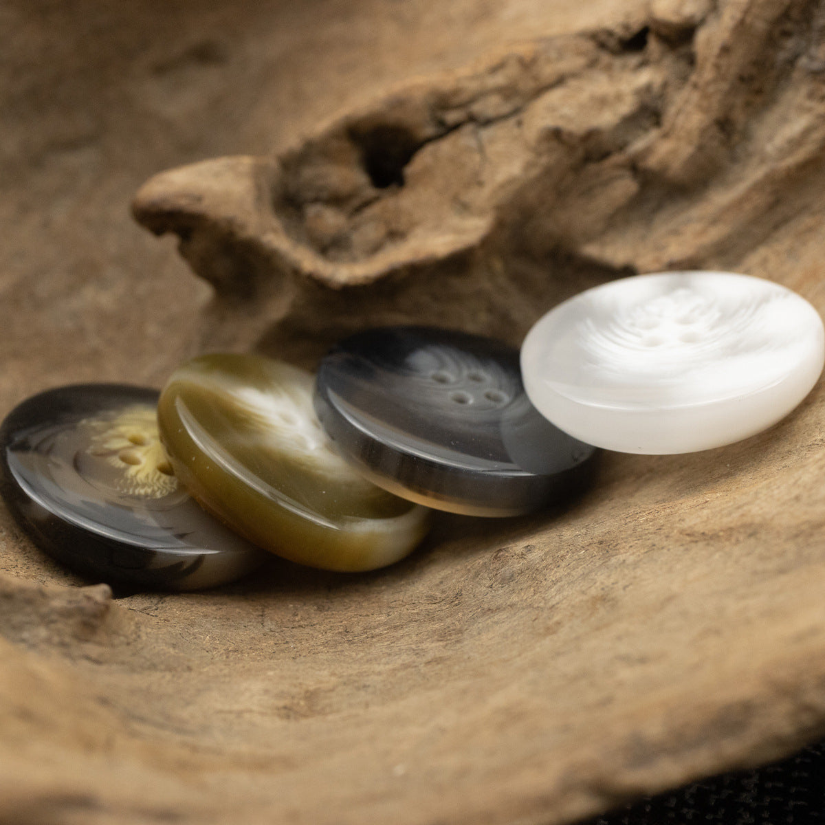 Bowl-shaped 4-hole resin suit buttons in brown, dark, and white