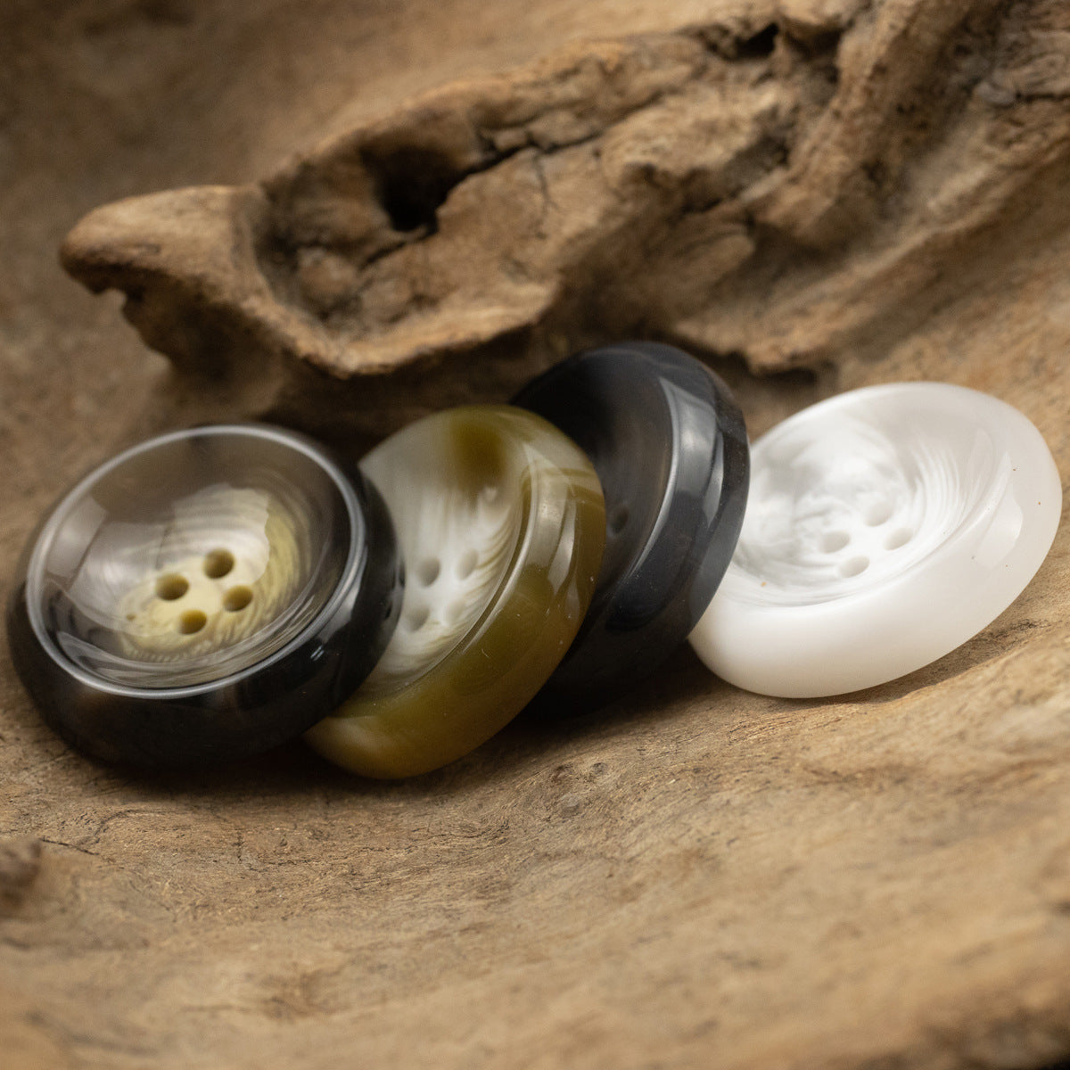 Bowl-shaped 4-hole resin suit buttons in black, olive green, and white