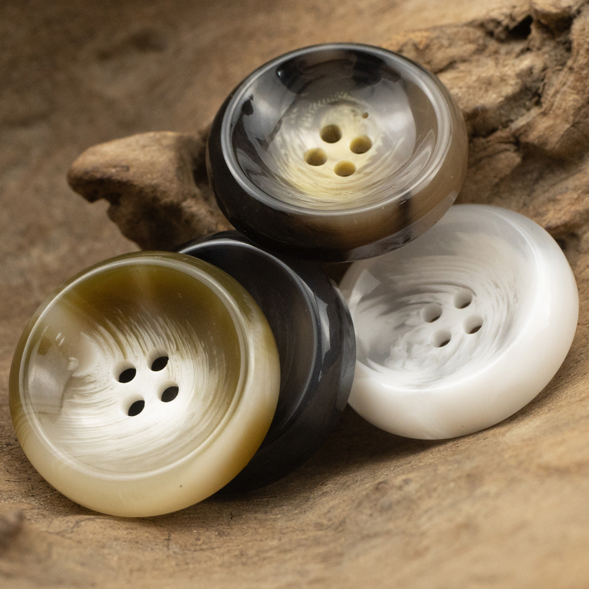 4-hole resin suit buttons set in white, dark brown, black, and green tones