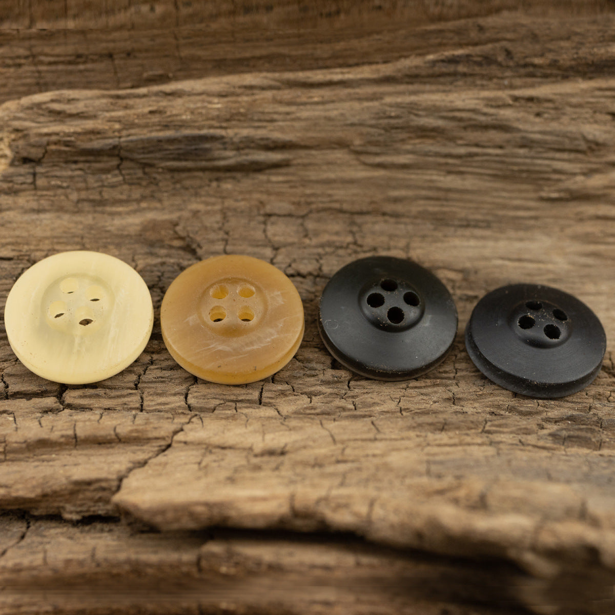 Matte resin 11.5mm buttons, 4-hole: two light yellow and two dark