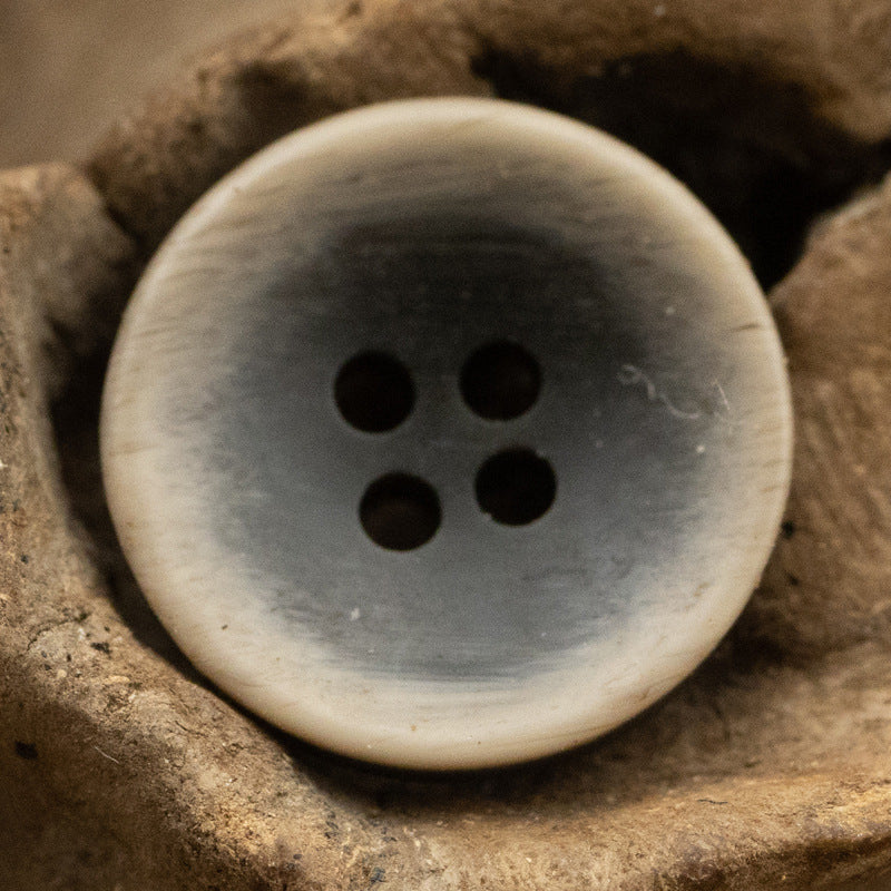 Dark gray matte bowl-shaped resin button, 4 holes, front view