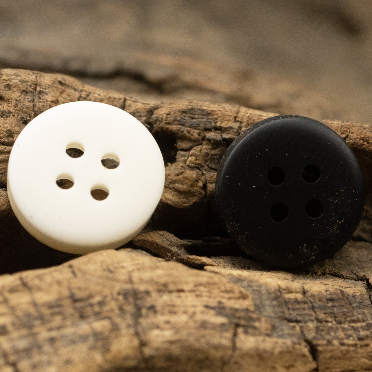 Light yellow and black 4-hole resin buttons, wood grain finish, round