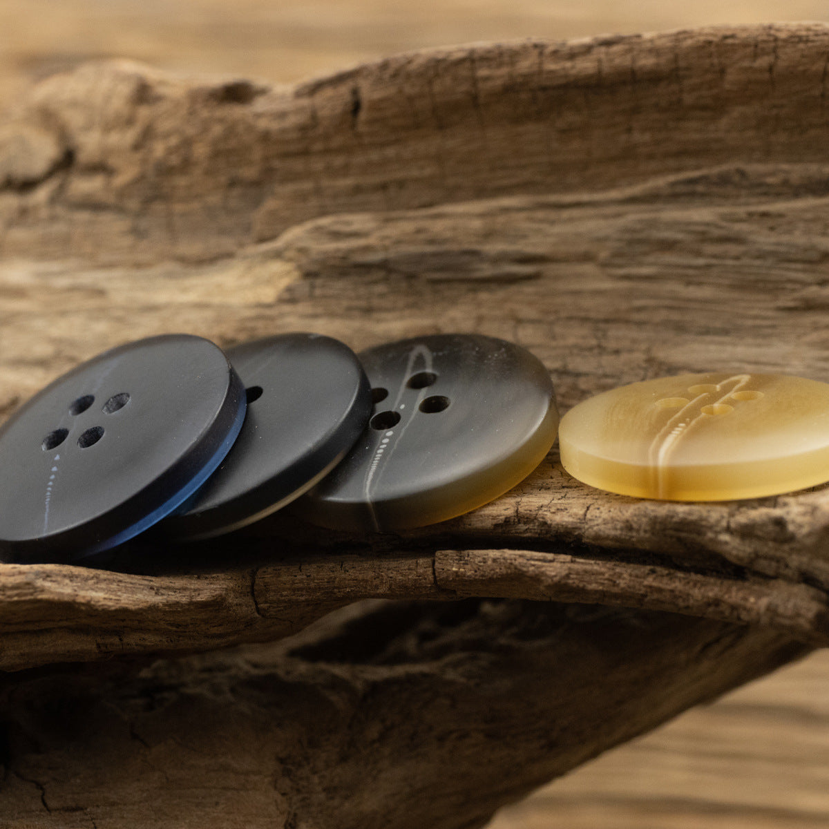 Assorted river-pattern resin buttons: dark blue, black, and khaki, round 4-hole style