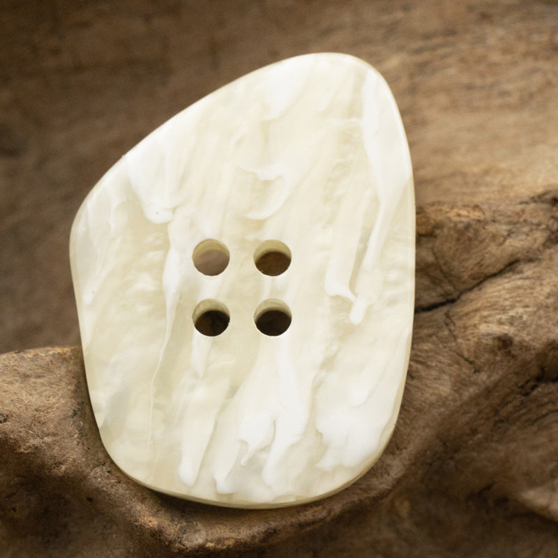 Off-white marble-effect resin coat button, glossy polygon, 4-hole front