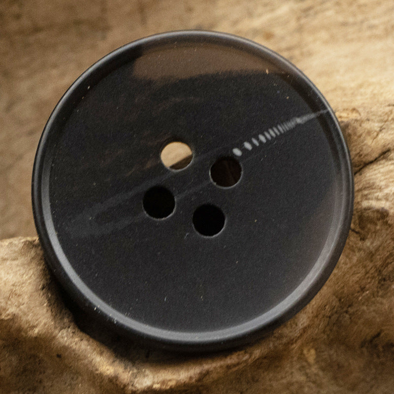 Black resin button with river pattern stripe, round 4-hole front