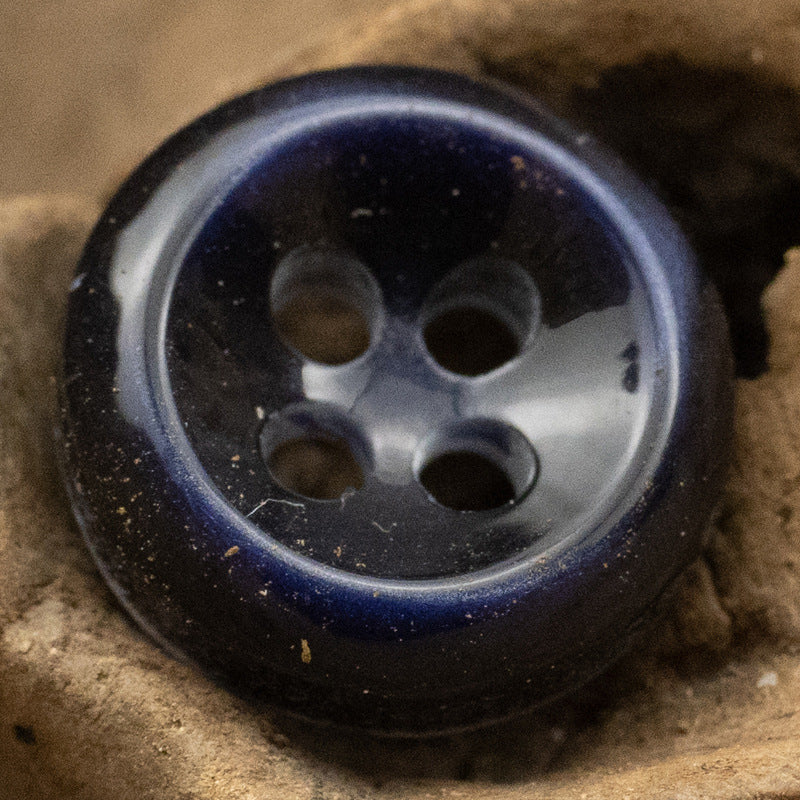 Dark blue pearlized resin button with 4 holes, beveled edge