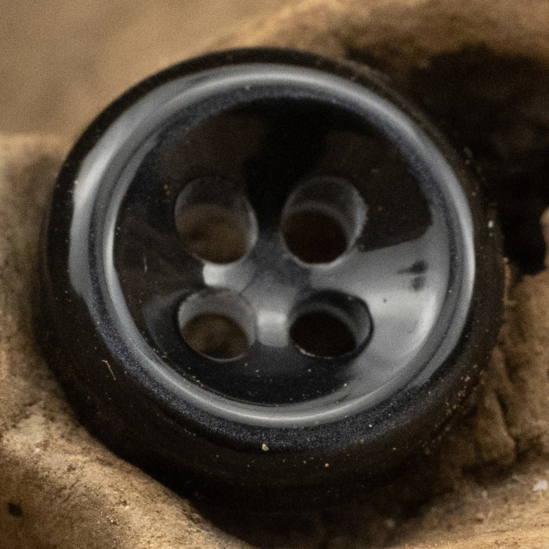 Black pearlized resin button with 4 holes, beveled edge