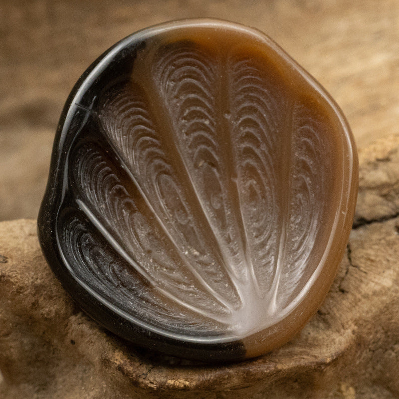 Brown fan-shaped resin shank button with feather-textured surface