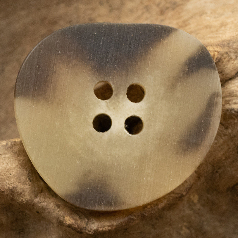 Peach-shaped resin buttons in khaki/gold, 4-hole pattern