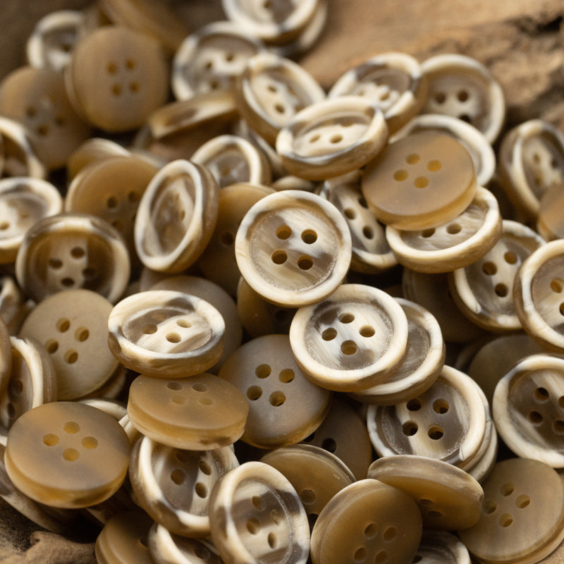 Resin buttons 10/11.5 mm, 4-hole, tan and amber buttons pile.