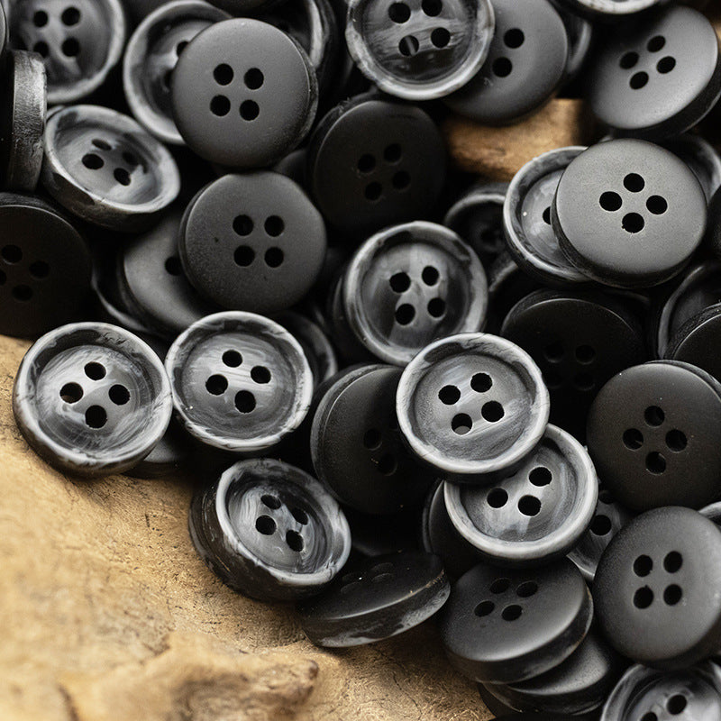 Resin buttons 10/11.5 mm, 4-hole, dark gray and black buttons pile.