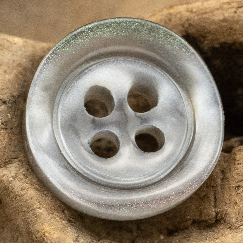 Gray translucent glazed pearl resin button with four holes and glossy wide rim