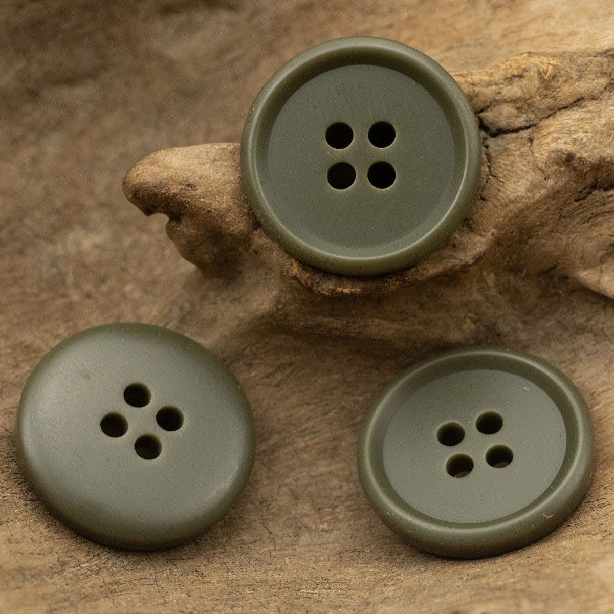 Army green round resin buttons with 4 holes, matte finish (set view)