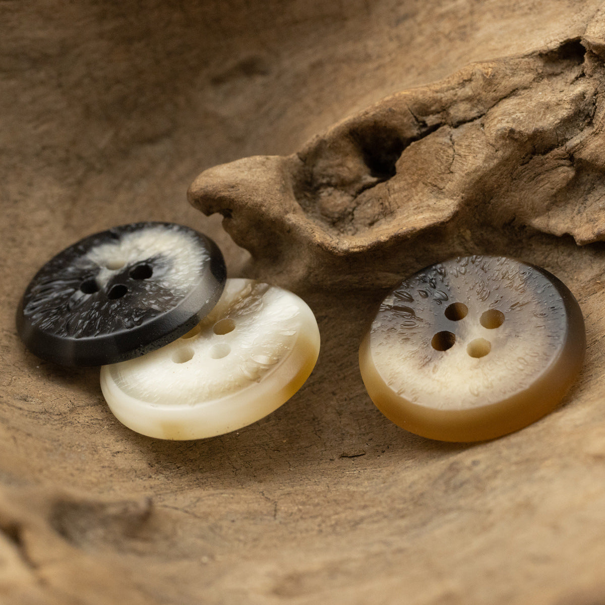 Assorted uneven-surface resin buttons in black, white, and brown; multiple 4-hole views, 30-pack