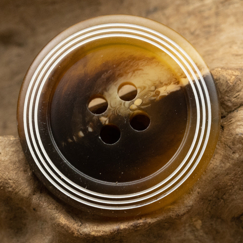 Amber matte 4-hole resin button with white ring stripes
