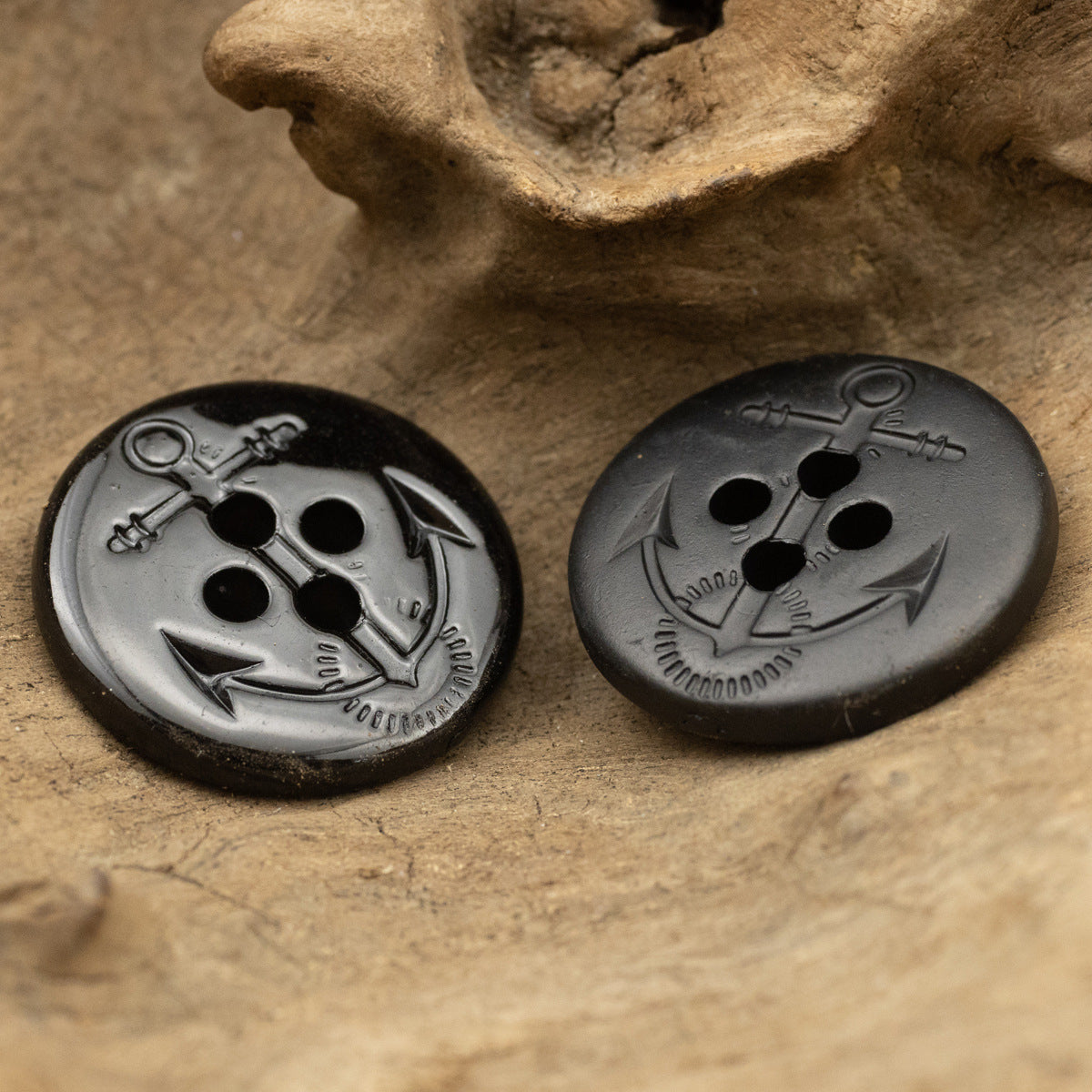 Glossy black resin anchor button pair, round 4-hole
