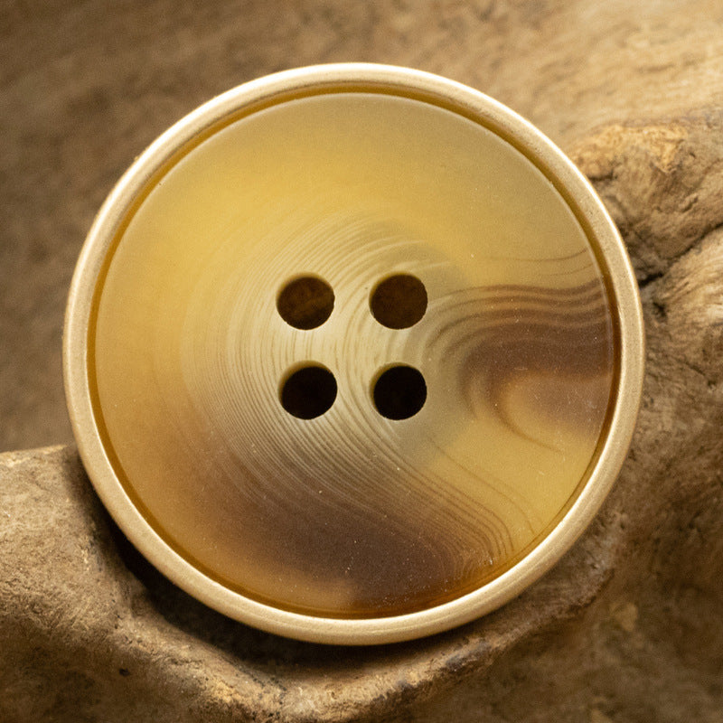 Khaki resin coat button with metal edge, round face, 4-hole detail