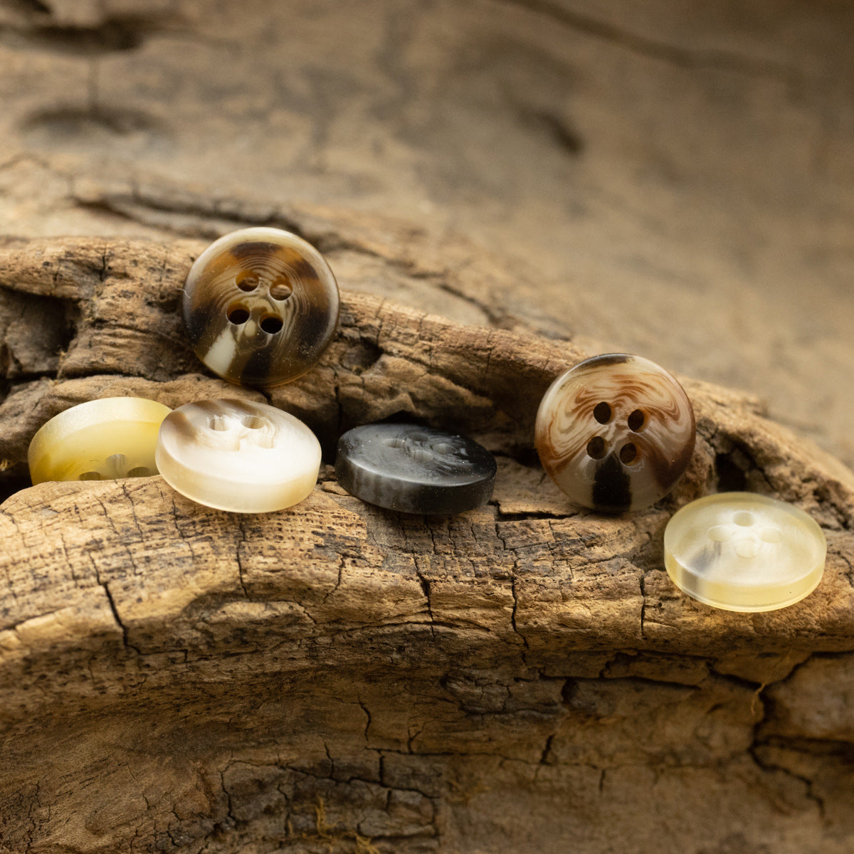 11.5mm round 4-hole resin buttons set with light yellow, white, gray, and brown patterns