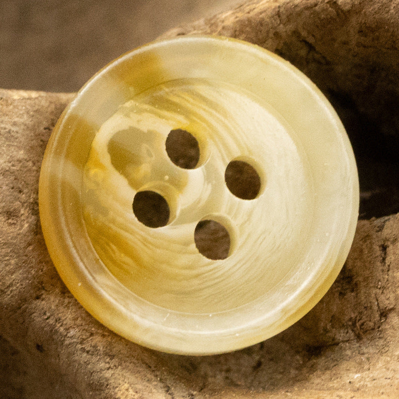Yellow resin round button with 4 holes, 11.5mm, swirled translucent finish