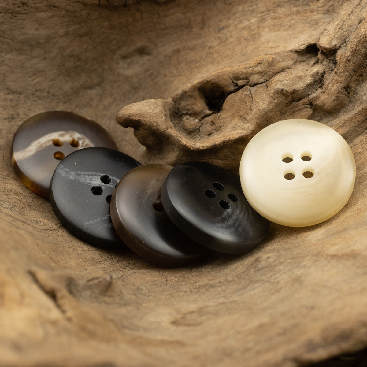 Black coffee resin button, round with four holes